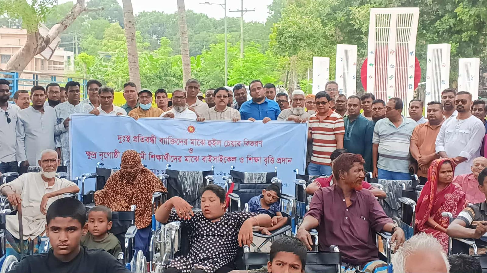 শ্রীপুরে হুইল চেয়ার-শিক্ষাবৃত্তির চেক ও বাইসাইকেল বিতরণ